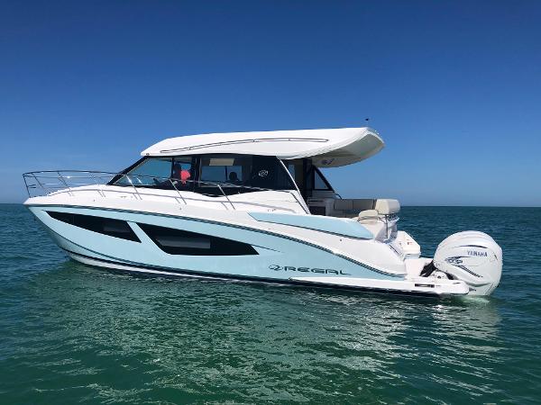 Regal 42 XO 2021 Regal 42 XO yacht cruising on clear blue water.