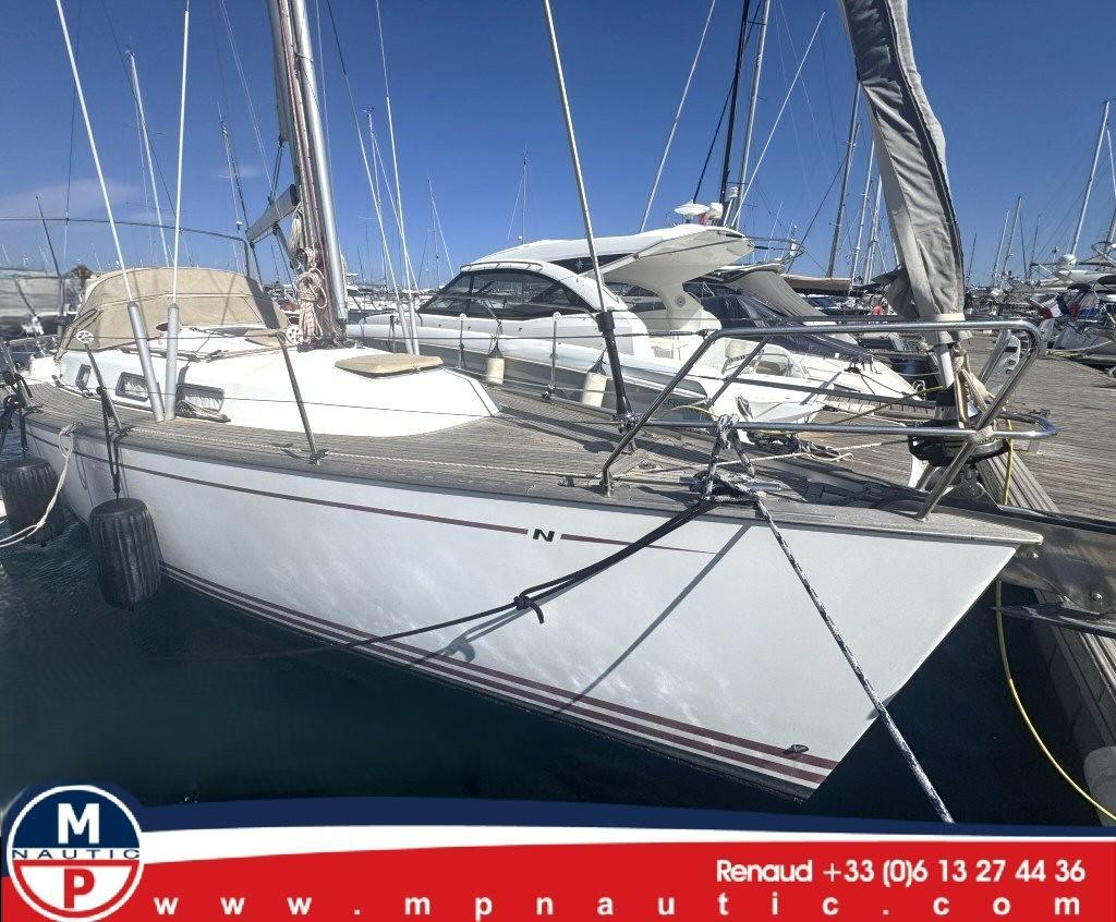 Najad 355 Najad 355 sailboat from 2008 docked at a marina, clear blue sky.