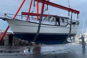 Nauticat 33 Nauticat 33 sailboat from 1991 being lifted by crane at a marina.