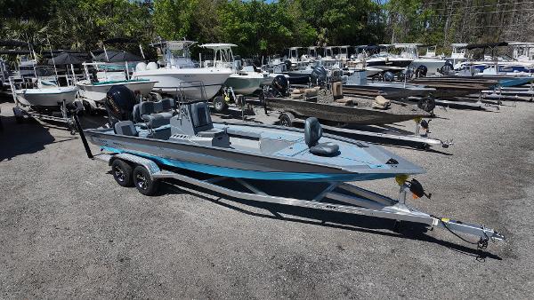 Xpress H24B 2025 Xpress H24B boat on trailer in outdoor showroom with multiple boats.