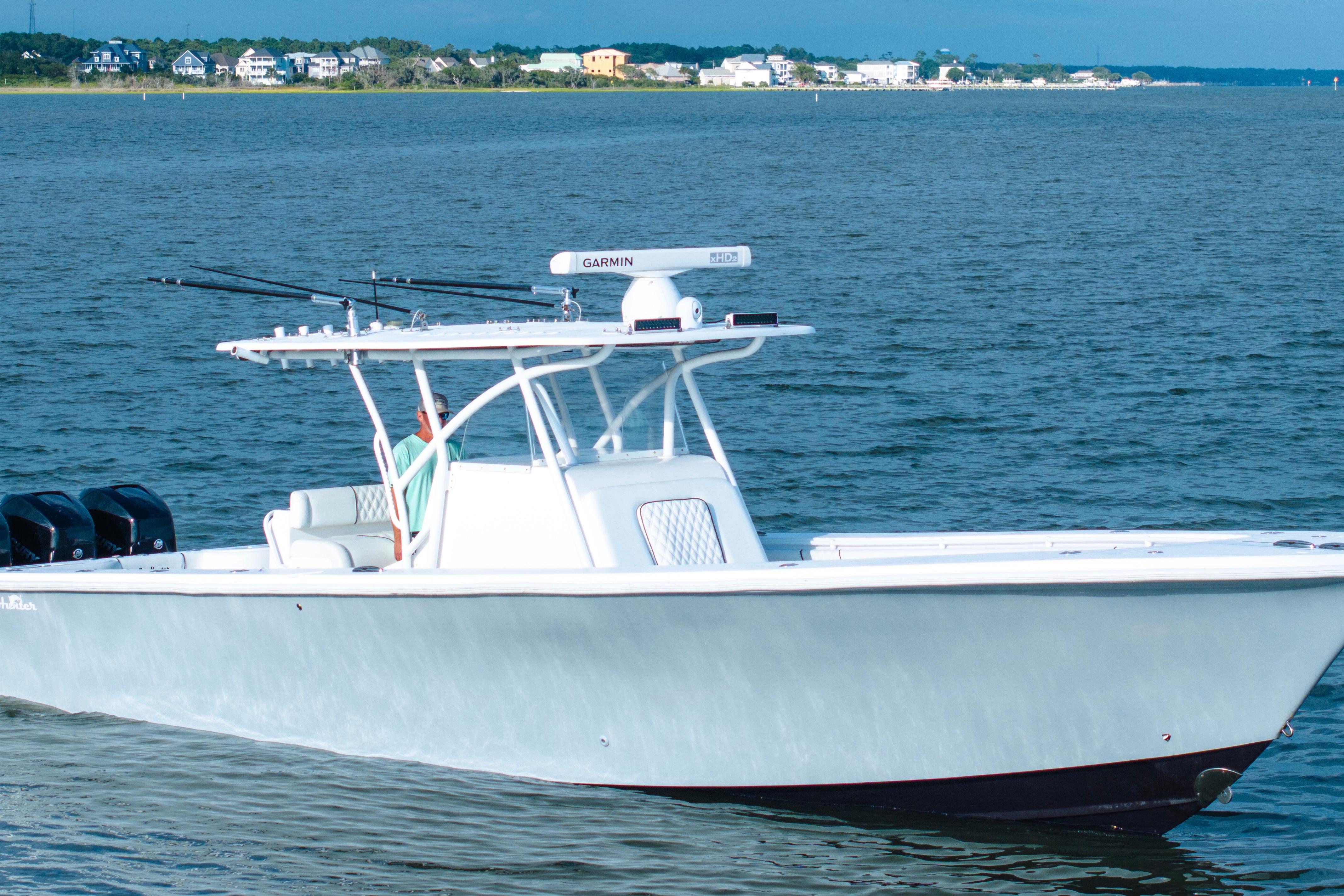 SeaHunter 37 Tournament 2012 SeaHunter 37 Tournament boat on calm water with coastal background.