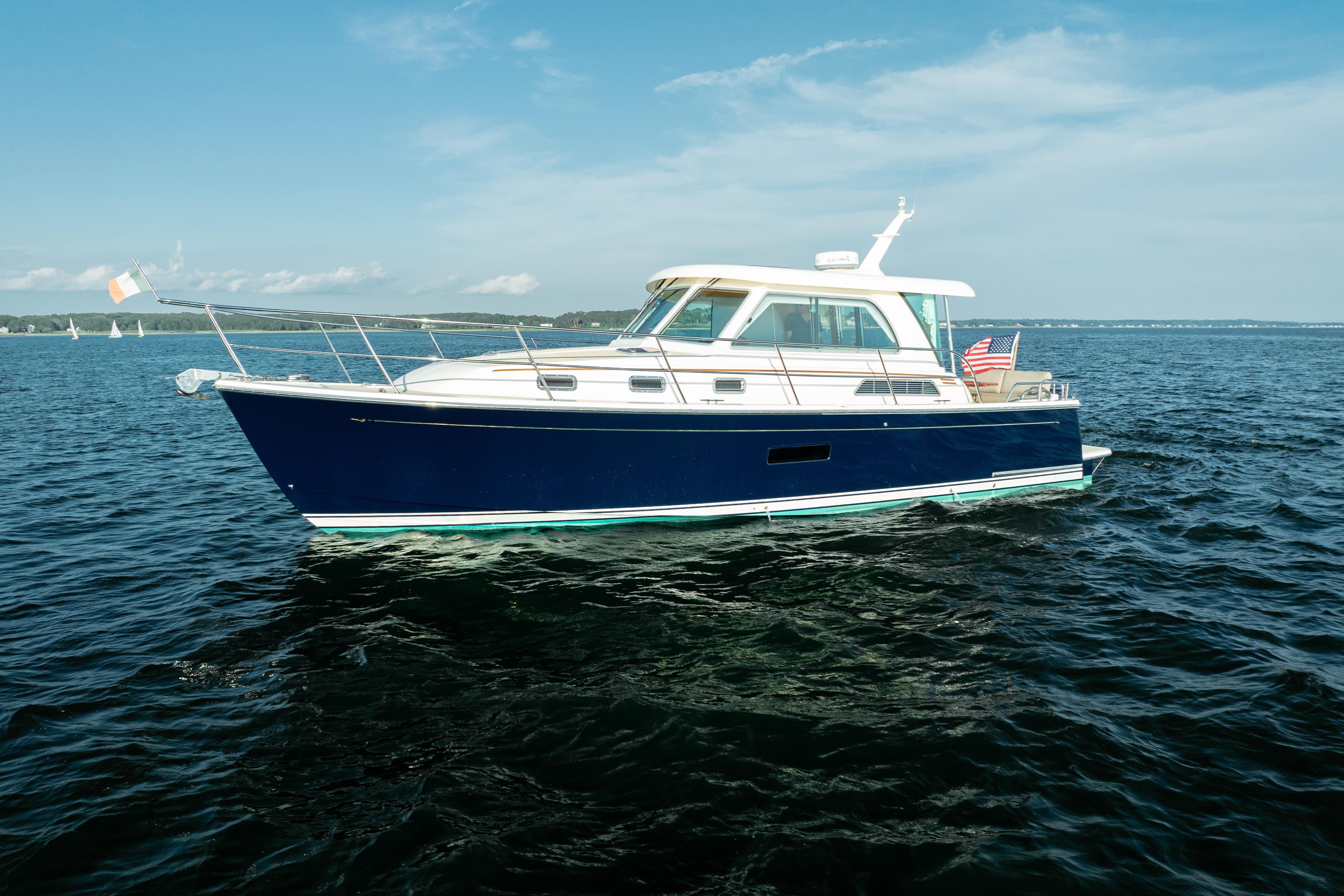 Sabre 38 Salon Express 2013 Sabre 38 Salon Express yacht cruising on open water under clear skies.
