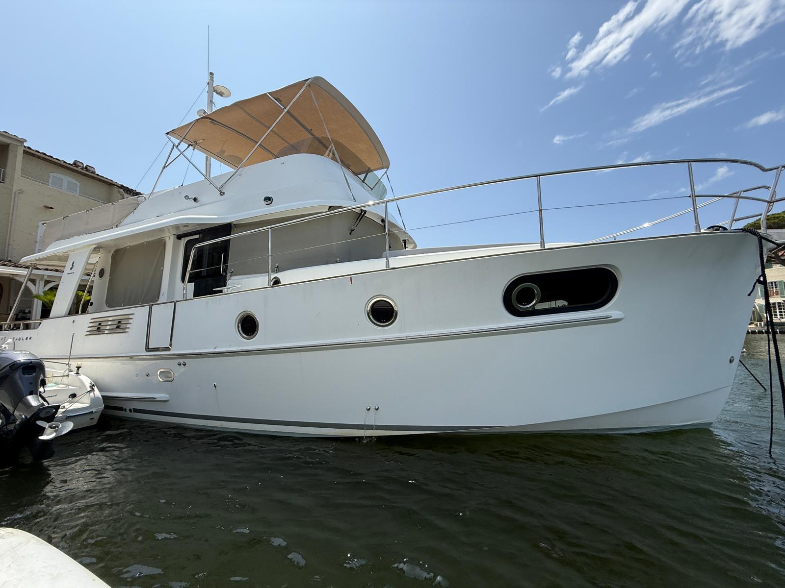 Beneteau Swift Trawler 44 2016 Beneteau Swift Trawler 44 docked, showcasing sleek design and spacious deck.