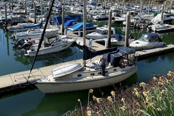 Caliber 35 Sailboat Caliber 35, 1994 model, docked in a marina surrounded by other boats.