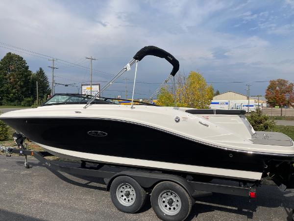 Sea Ray SPX 230 2024 Sea Ray SPX 230 boat on trailer, black and white exterior.