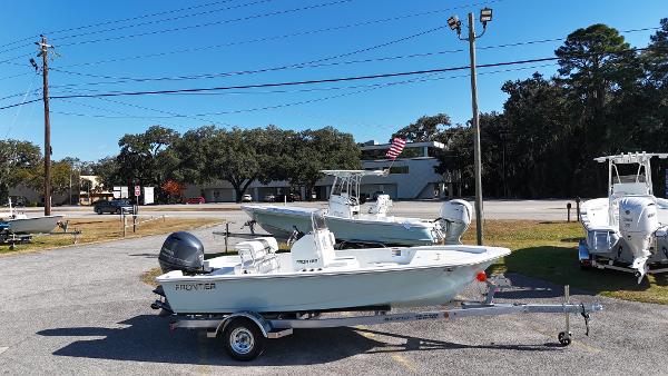 Frontier 180 2025 Frontier 180 boat on trailer in outdoor lot, clear sky background.