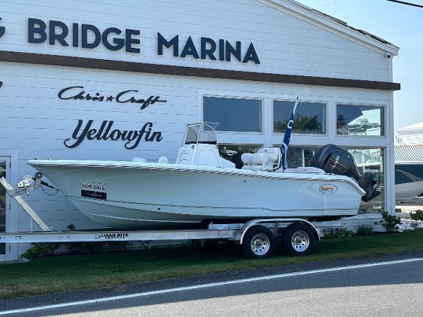 Sea Hunt Ultra 219 2026 Sea Hunt Ultra 219 boat on trailer outside Bridge Marina, for sale.