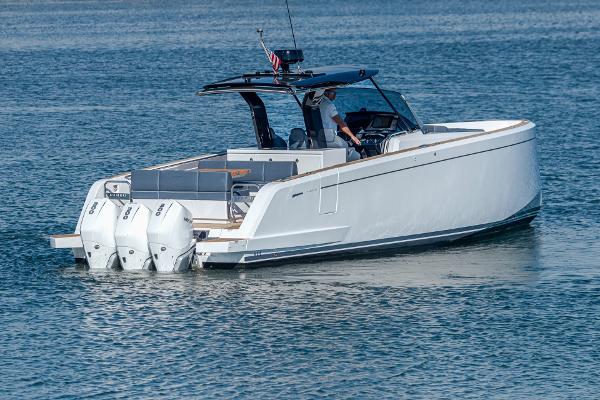 Pardo Yachts P38 2023 Pardo Yachts P38 cruising on water with triple outboard engines.