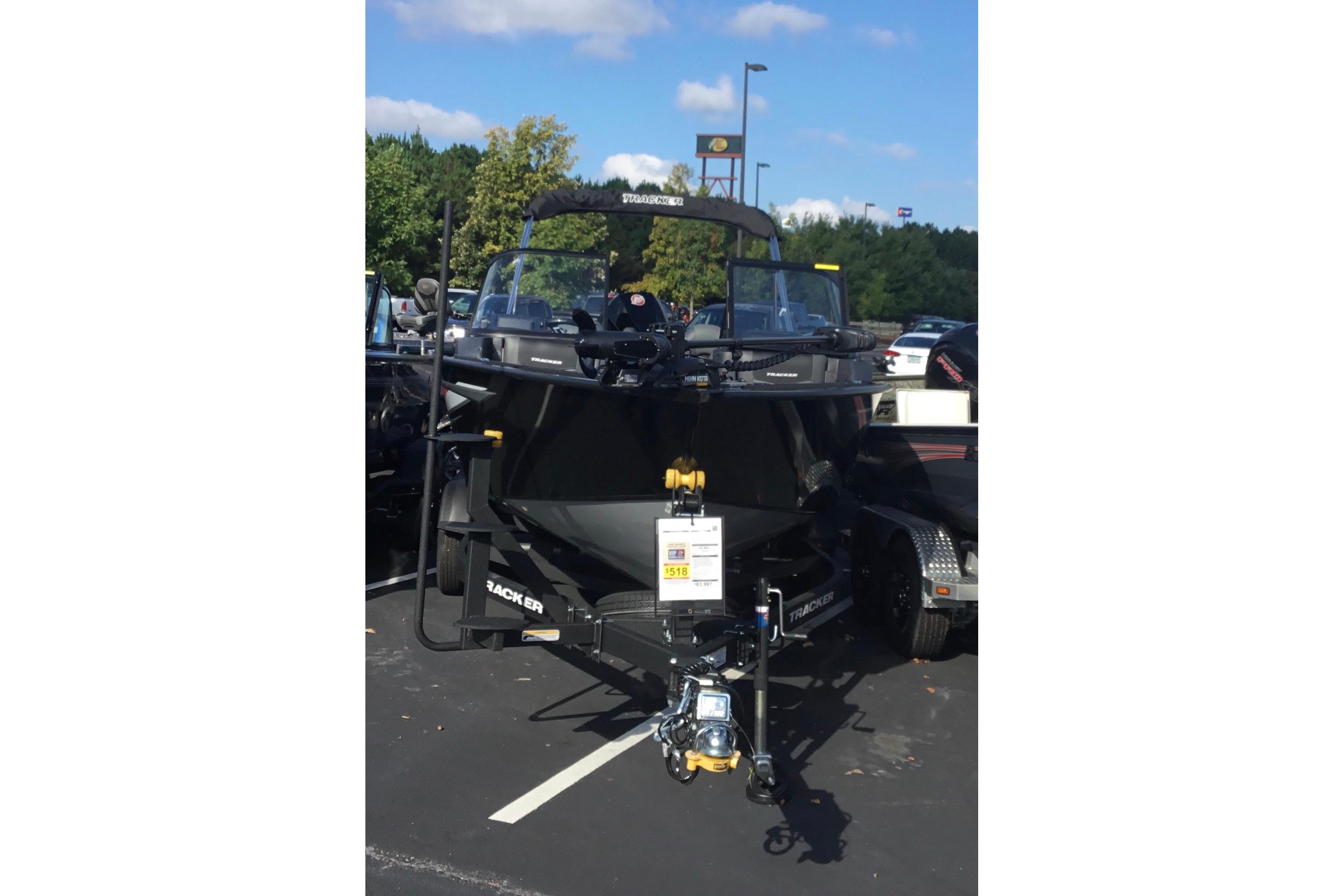 Tracker Targa V-19 Combo 2026 Tracker Targa V-19 Combo boat on trailer in parking lot.
