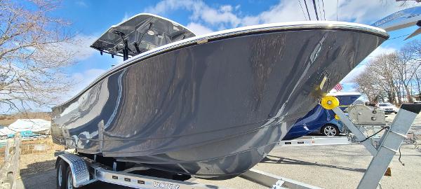 Sea Born SX239 Offshore 2023 Sea Born SX239 Offshore boat on a trailer under a blue sky.