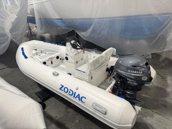 Zodiac Nomad 3.6 RIB Alu 2024 Zodiac Nomad 3.6 RIB Alu boat with Yamaha outboard motor in storage.