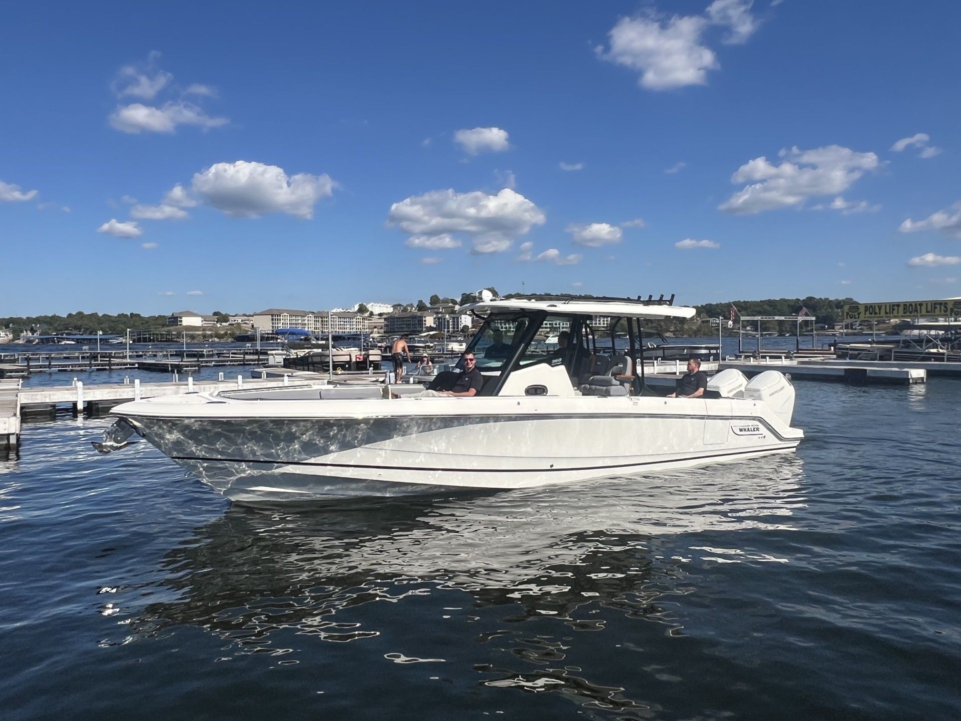 Boston Whaler 360 Outrage 2026 Boston Whaler 360 Outrage boat on calm water under a clear blue sky.