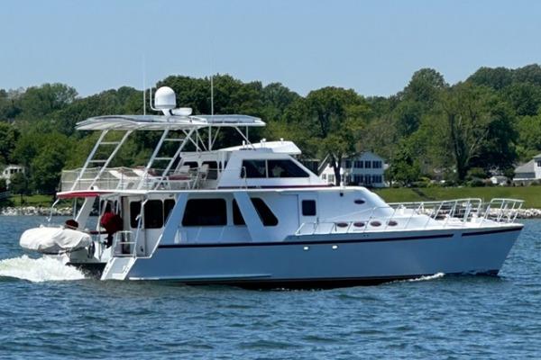 Custom Crosswater Passagemaker 49 2001 Crosswater Passagemaker 49 yacht cruising on a scenic lake.