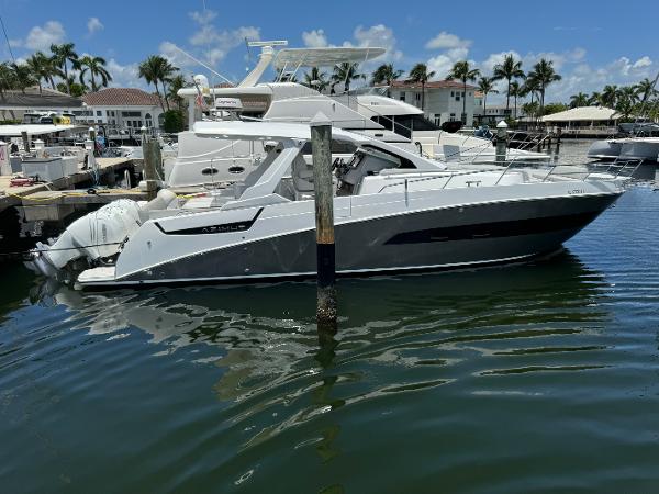 Azimut Verve 40 2019 Azimut Verve 40 yacht docked in a marina, surrounded by palm trees.