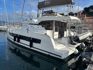 Bali CATSPACE 2023 Bali CATSPACE catamaran docked in a marina, featuring sleek design and modern amenities.