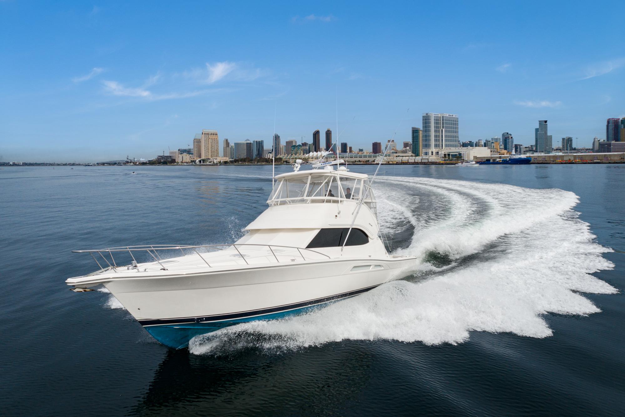 Riviera 47 Open Flybridge Series II 2009 Riviera 47 Open Flybridge Series II cruising near city skyline.
