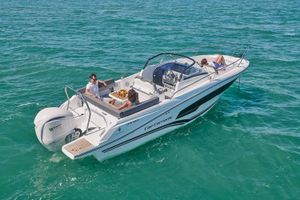 Jeanneau Cap Camarat 7.5 WA 2024 Jeanneau Cap Camarat 7.5 WA boat cruising on clear blue water.