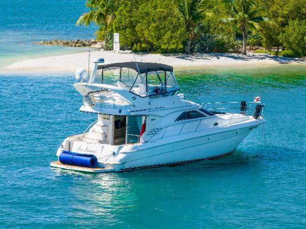 Sea Ray 400 Sedan Bridge 2003 Sea Ray 400 Sedan Bridge yacht near tropical island with palm trees.