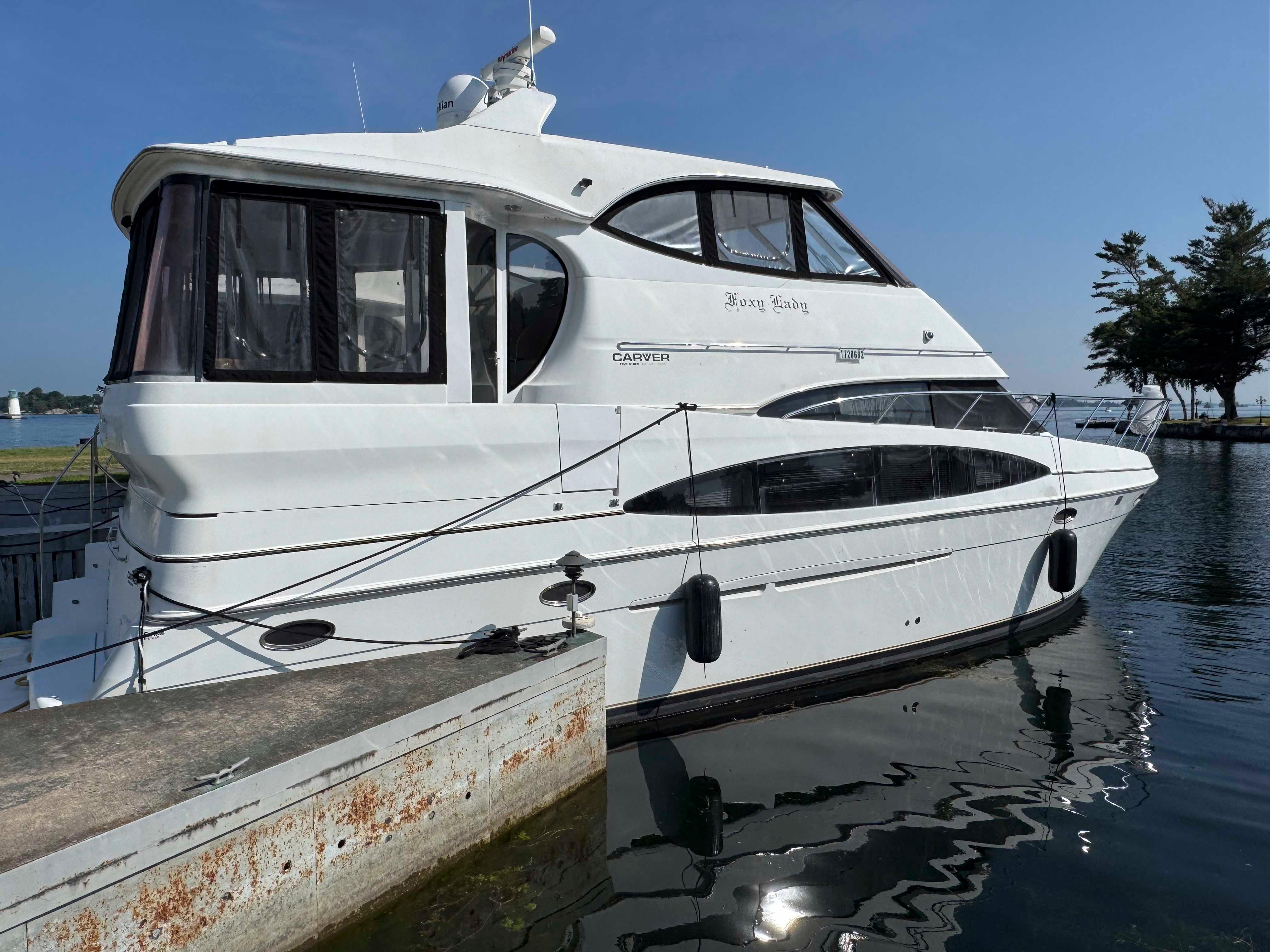 Carver 506 Motor Yacht 2001 Carver 506 Motor Yacht docked at a marina on a sunny day.