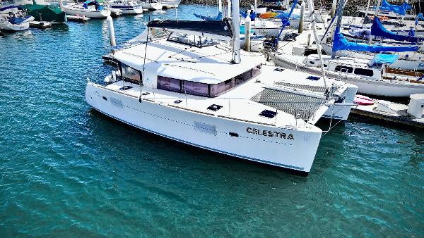Lagoon 400 S2 2017 Lagoon 400 S2 catamaran docked in a marina, surrounded by other boats.