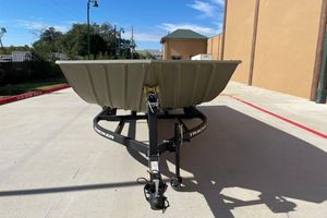 Tracker Grizzly 2072 Utility 2026 Tracker Grizzly 2072 Utility boat on trailer in outdoor setting.