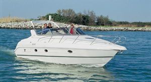 Cranchi Giada 30 Cranchi Giada 30 yacht from 2000 cruising on a calm blue sea.