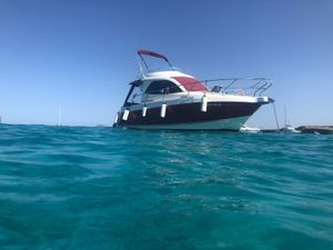 Starfisher 27 Cruiser Fly Starfisher 27 Cruiser Fly 2008 boat on clear blue water under a sunny sky.