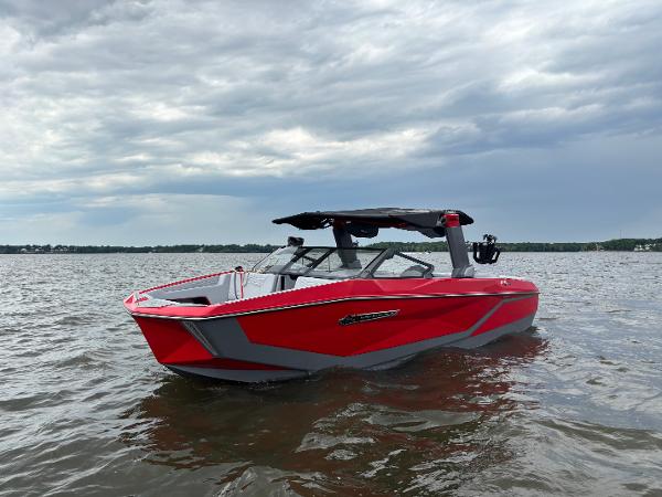 Nautique Super Air Nautique G25 2025 Nautique Super Air Nautique G25 boat on water, under cloudy sky.