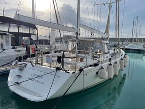 Amel 64 Sailing yacht Amel 64, 2016 model, docked in a marina with calm waters.