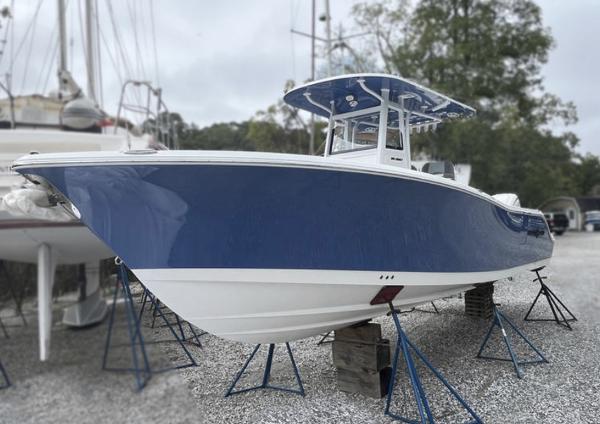 NauticStar 292 Legacy 2025 NauticStar 292 Legacy boat in dry dock, blue and white hull.