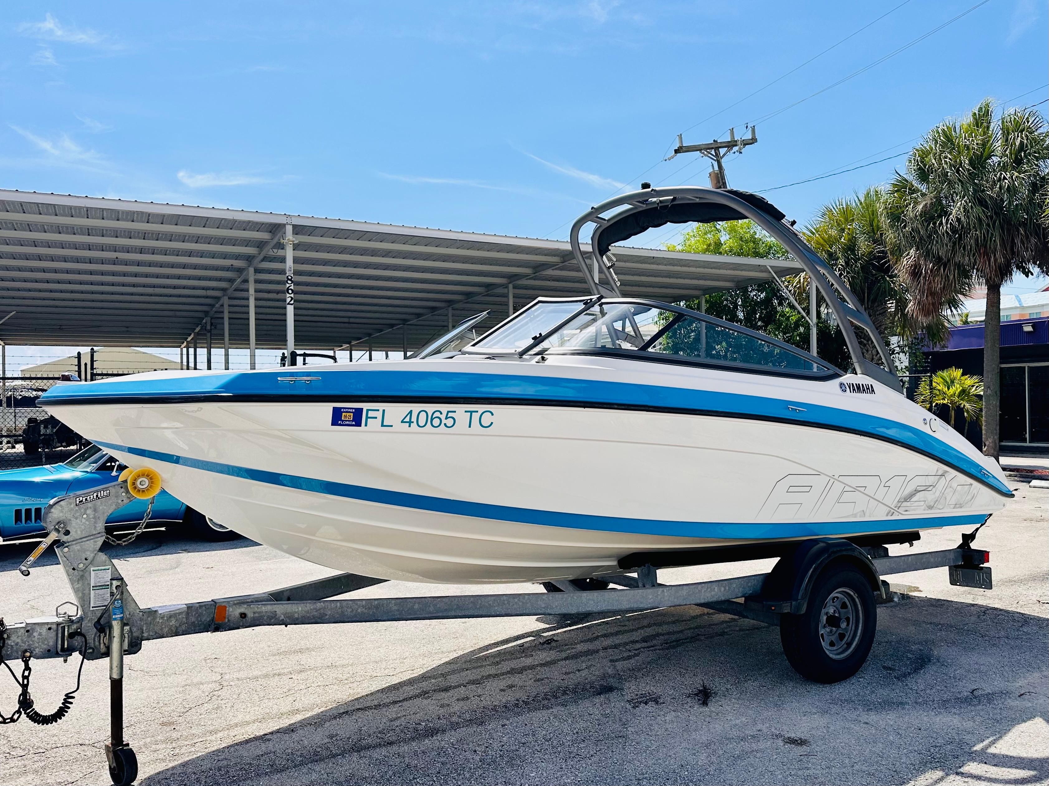 Yamaha Boats AR190 2022 Yamaha AR190 boat on trailer, parked outdoors under clear sky.