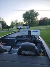Skeeter ZX200 2023 Skeeter ZX 200 boat interior with Garmin and Lowrance equipment, set in a grassy area.