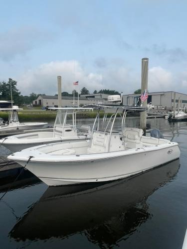 Sea Hunt Ultra 234 2017 Sea Hunt Ultra 234 boat docked in marina, calm water, overcast sky.