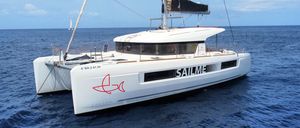 Lagoon 40 2020 Lagoon 40 catamaran sailing on open sea under clear skies.