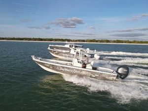Pathfinder 2600 HPS 2014 Pathfinder 2600 HPS boats cruising on open water under a clear sky.