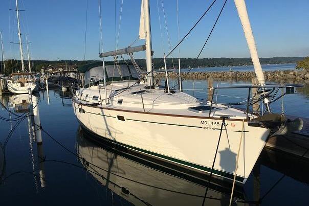 Beneteau Oceanis 461 1999 Beneteau Oceanis 461 sailboat docked in a serene marina setting.