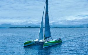 Custom John Hughes Bladerunner Sleek 2016 Custom John Hughes Bladerunner catamaran sailing on calm blue waters.