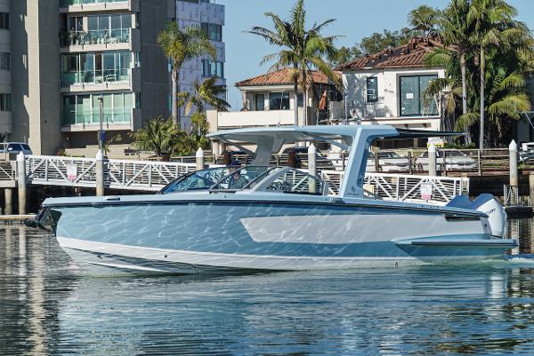 Aviara AV 32 2024 Aviara AV 32 boat docked near waterfront homes.