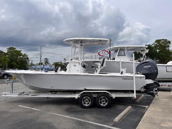 Tidewater 2300 Carolina Bay 2025 Tidewater 2300 Carolina Bay boat on trailer, parked outdoors under cloudy sky.