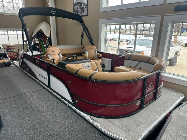 Crest Classic 200 2025 Crest Classic 200 pontoon boat with tan seating in showroom.