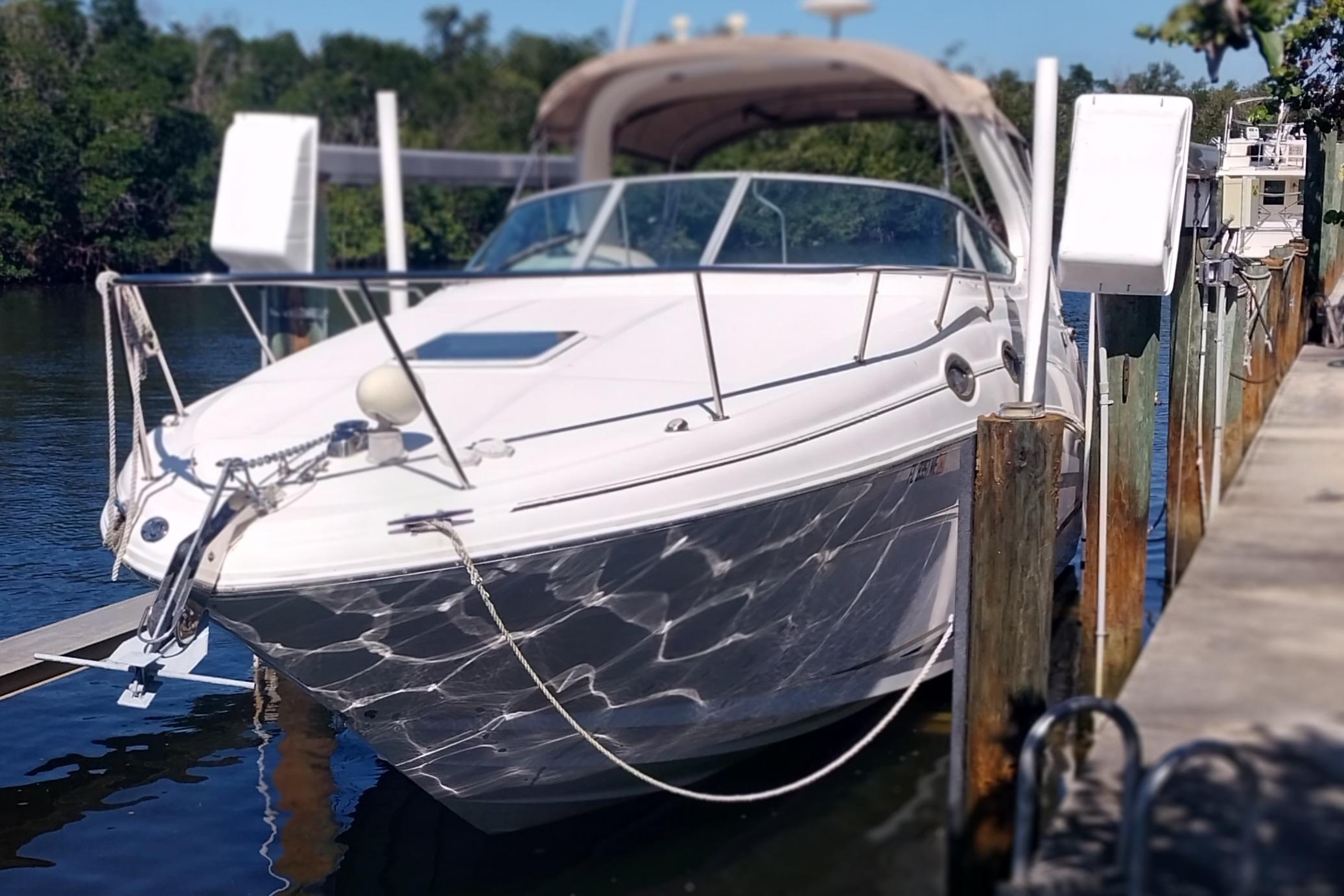 Sea Ray 280 Sundancer 2003 Searay 280 Sundancer docked by a serene waterfront.