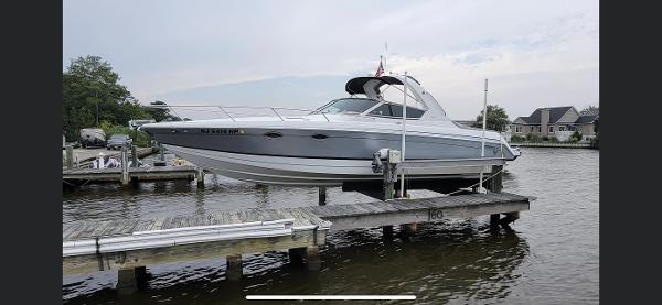 Formula 330 Sun Sport 2005 Formula 330 Sun Sport boat docked on a lift by the water.