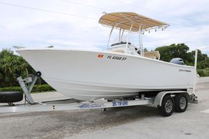 Sportsman Open 212 Center Console 2021 Sportsman Open 212 Center Console boat on trailer, parked outdoors.