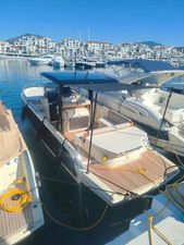 Invictus GT 280 2024 Invictus GT 280 boat docked in a sunny marina, surrounded by other vessels.