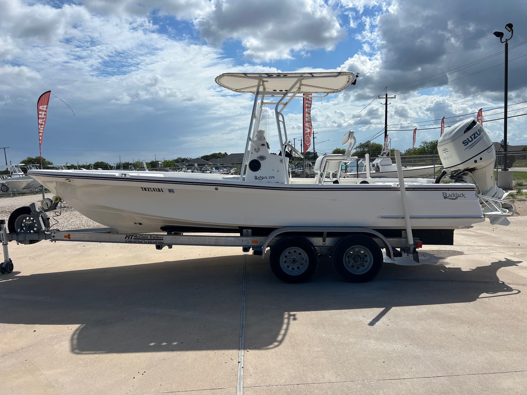K2 BLACKJACK 224 2007 K2 BLACKJACK 224 boat on trailer, under cloudy sky.