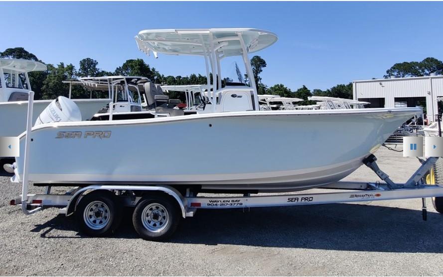 Sea Pro 222 Center Console 2024 Sea Pro 222 Center Console boat on trailer, parked outdoors.
