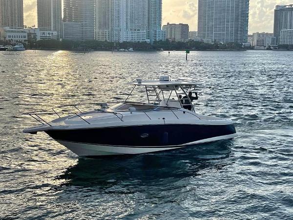 Sunseeker Sportfisher 37 2004 Sunseeker Sportfisher 37 boat on water with city skyline background.