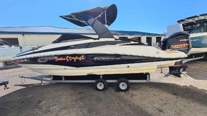 Crownline Eclipse E4 XS 2018 Crownline Eclipse E24 XS boat on trailer, featuring sleek design and canopy.