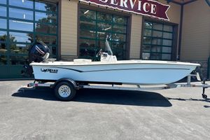 Mako Pro Skiff 17 CC 2026 Mako Pro Skiff 17 CC boat on trailer outside service center.