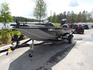 Tracker Pro Team 175 TXW 2021 Tracker Pro Team 175 TXW boat on trailer, parked near a lake.